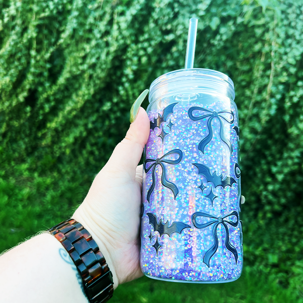 Tumbler filled with rhinestones and decorated with bats and bows