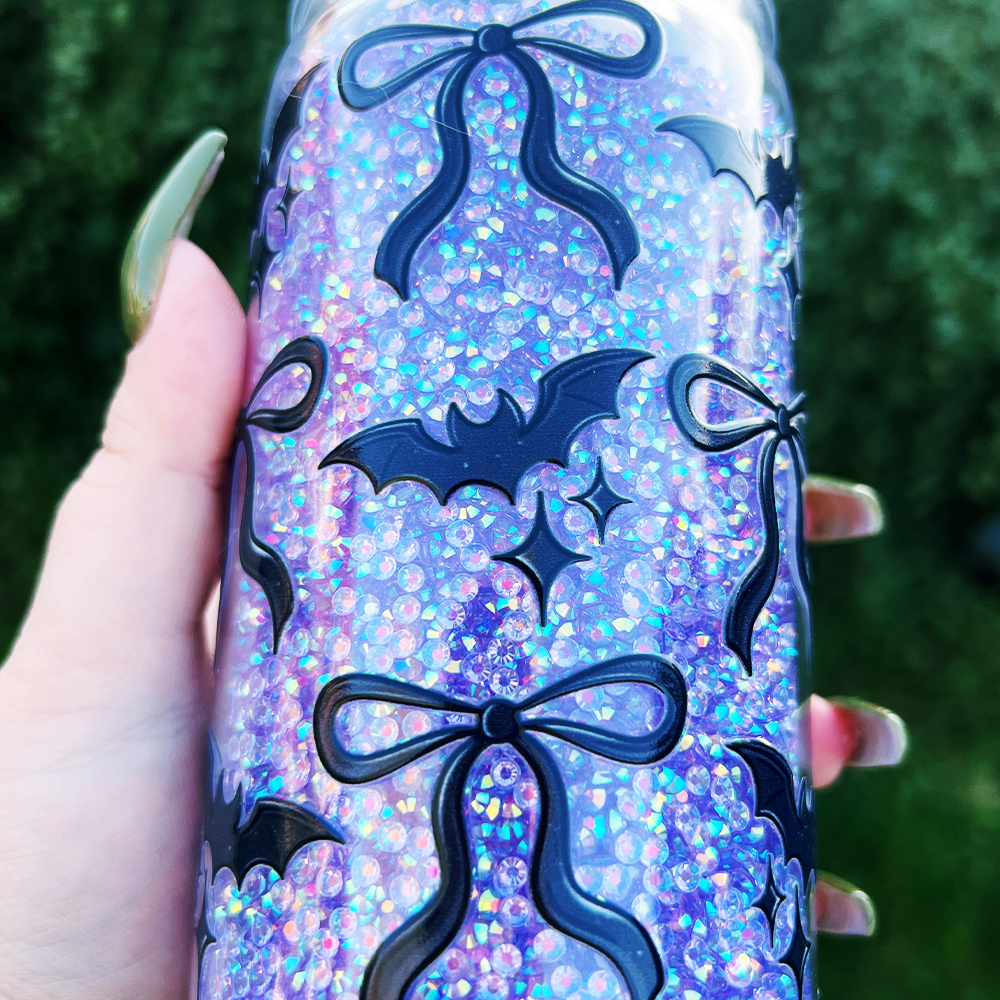 Tumbler filled with rhinestones and decorated with bats and bows