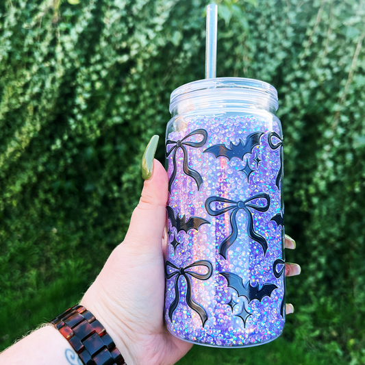 Tumbler filled with rhinestones and decorated with bats and bows